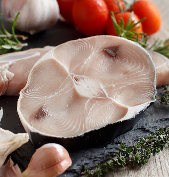 Two shark steak with vegetables and herbs