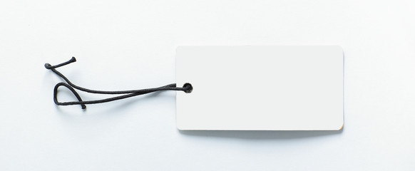 blank decorative tag made of cardboard on a white