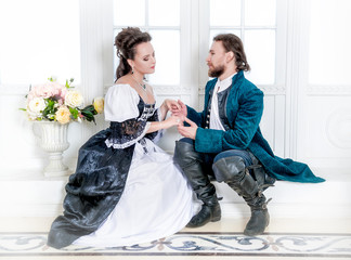 Beautiful couple woman and man in medieval clothes
