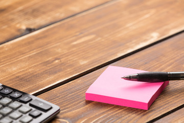 paper on pen with calculator on desk