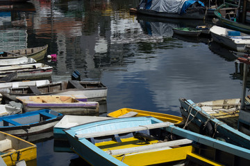 Fototapeta na wymiar photograph of wooden fishing boats parked together on urca beach in the city of rio de janeiro