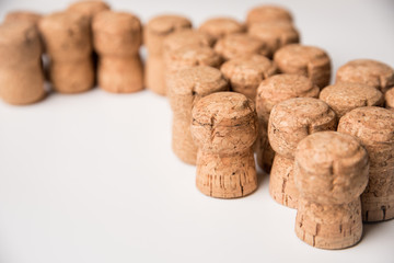 Background of wine corks on white background, top view