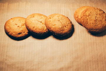 Simple view of round biscuits on baking paper background