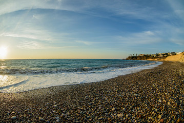 sea surface and sunny summer rocky coastline