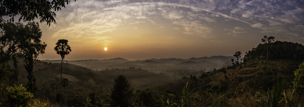 Landscape view of sunrise, mountains and foggy