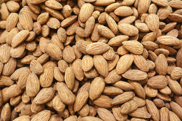 Pile of almonds as a background.