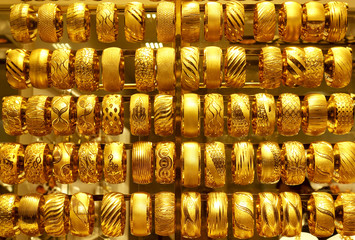 Rows of gold bracelets as a background in a jewelry store on the Grand Bazaar. Istanbul, Turkey.