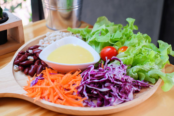 Mixed salad in wooden dish 
