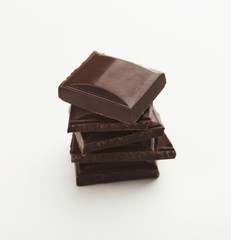 Bar of dark chocolate isolated on white