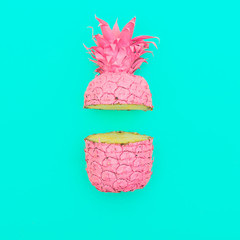 two painted in pink color halfs of the pineapple on turquoise background. minimalism and surrealism of food.