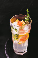 Gin bitter lemon with thyme and grapefruit. Fruit lemonade.