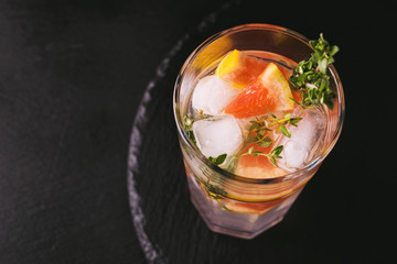Gin bitter lemon with thyme and grapefruit. Fruit lemonade.