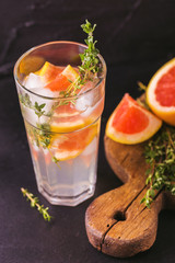 Gin bitter lemon with thyme and grapefruit. Fruit lemonade.
