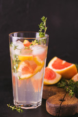 Gin bitter lemon with thyme and grapefruit. Fruit lemonade.