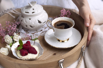 Flavored coffee . Breakfast in bed. Romance. White and pink flowers. light colors. Food and coffee on the tray