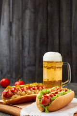 Two hot dogs and mug of beer