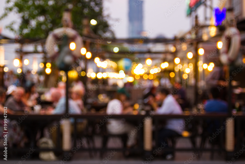 Poster abstract blur image of night festival in a restaurant and the atmosphere is happy and relaxing with 