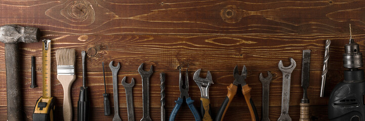 Labor day background - many handy tools, on wooden background top view with copy space for text.