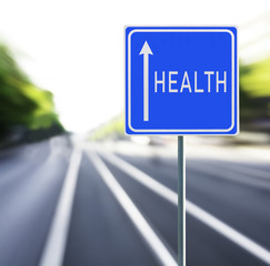 Health Road Sign on a Speedy Background.