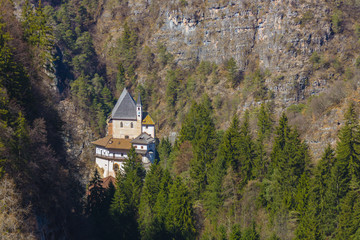 Picturesque view on the Sanctuary of San Romedio that is located on a steep rocky spur in the natural scenery of the Val di Non, Trentino, Italy