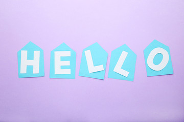 Inscription Hello on purple background