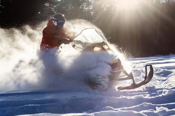 Athlete on a snowmobile