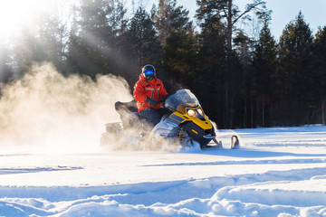 Athlete on a snowmobile
