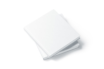 Two blank white hard cover books mock up, top view from the side. Empty square notebooks on each...