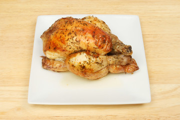 Roasted poussin on a plate