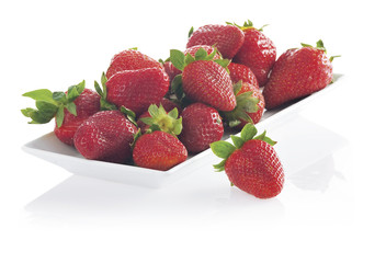 Juicy fresh strawberry in a bowl isolated on white background