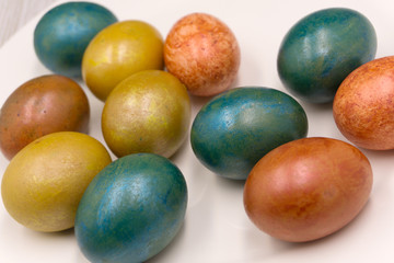 Old fashion pale multi colored Easter egg background .