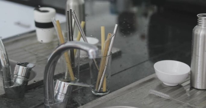 4k footage of Items of reusable utensils standing on the kitchen table . Zero waste concept