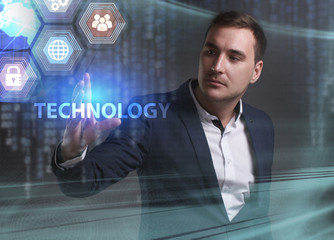 Business, Technology, Internet and network concept. Young businessman working on a virtual screen of the future and sees the inscription: Technology