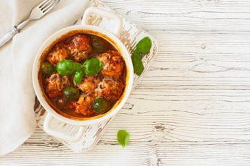 Meatballs and brussel cabbage stewed in tomato sauce