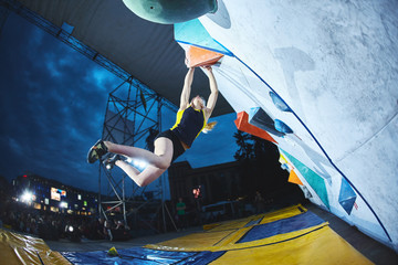 woman climber on the climbing competition