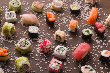 Assortment of colorful sushi and rolls background