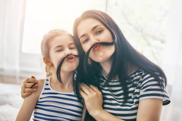 Mom and her daughter are playing