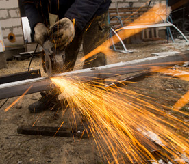 Sparks from metal cutting at the construction site