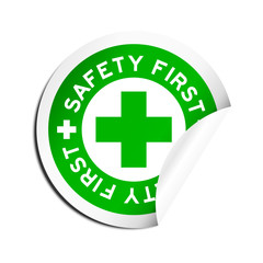 Safety first word peel off green sticker on white background