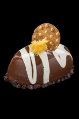 appetizing chocolate dessert. Isolated over black background
