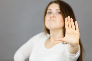 Angry apodicticity woman showing stop with hand