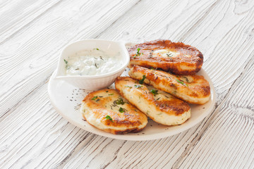 Cottage cheese pancakes or syrniki and yoghurt sauce