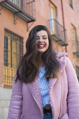 Fototapeta premium portrait young woman smiling in street