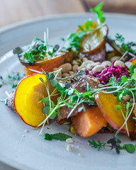Vegetarian sweet potato salad with greens