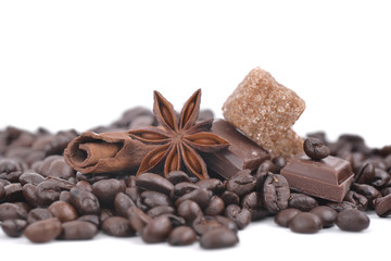 anise star, chocolate and sugar in heap of coffee beans 