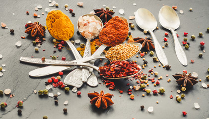 Spices and herbs. Variety of spices and herbs on a wooden surface