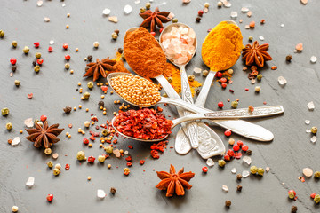 Spices and herbs. Variety of spices and herbs on a wooden surface