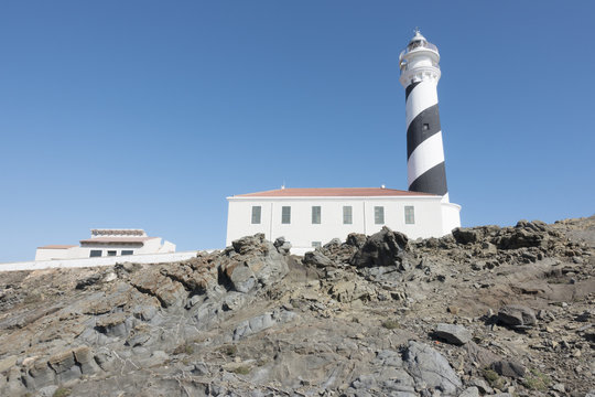 Lighthouse on the slate cape of Favaritx, Menorca, Balearic Islands, Spain