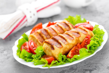Pancakes. Pancakes stuffed on plate. Wrapped pancakes
