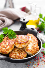 Cutlets. Fried cutlets in cast-iron pan on table
